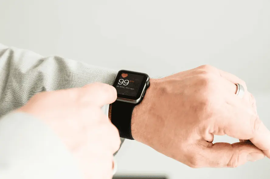 Man checking pulse with apple watch