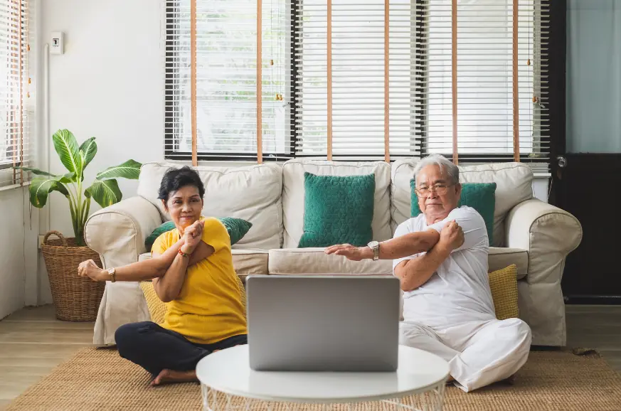 man and woman performing quick workout at home