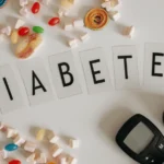 Image of the Word Diabetes Spelled with surrounding candy and glucometer